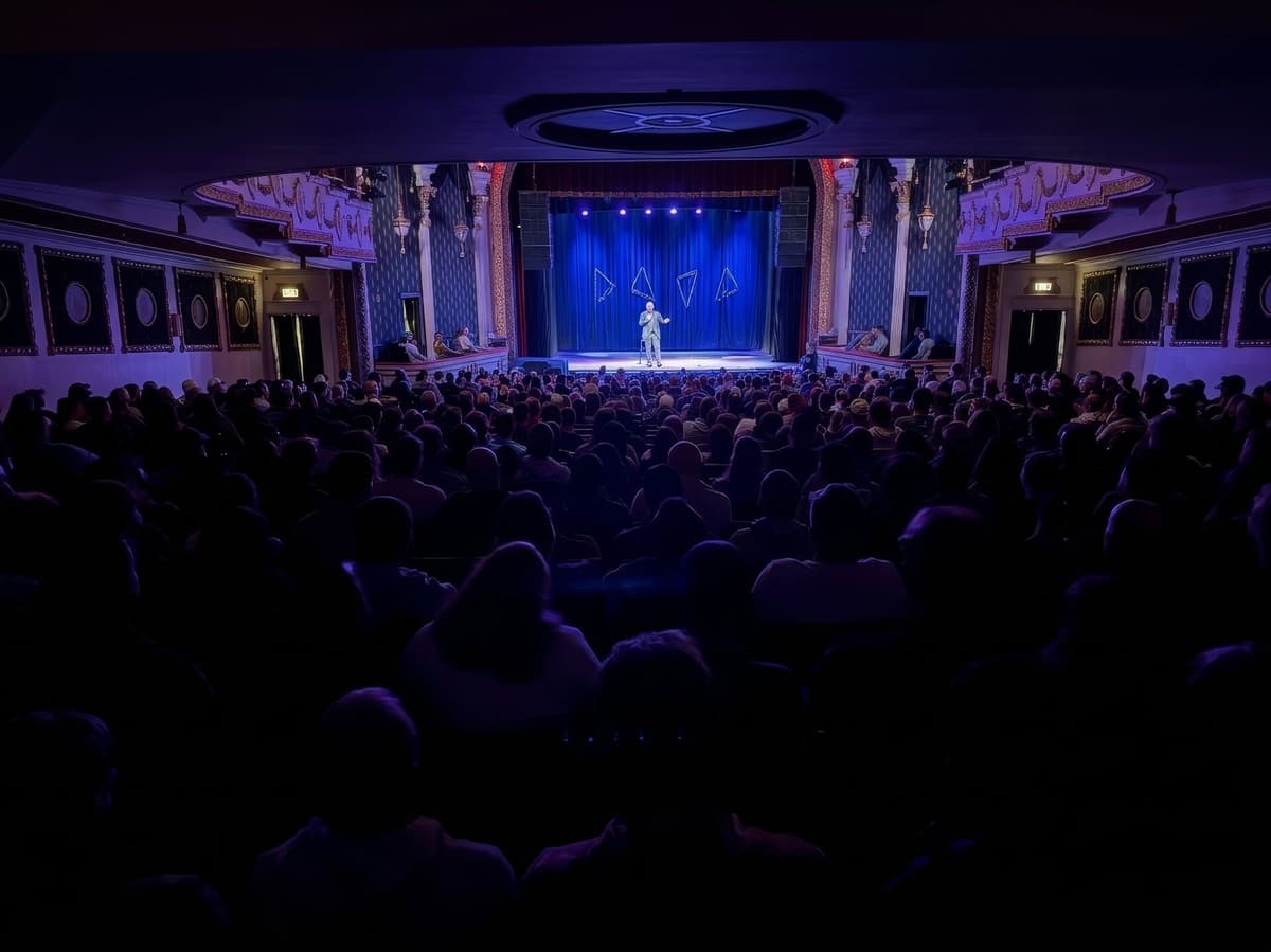 Full house watching a performer on stage
